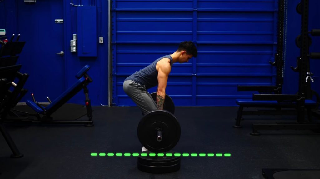 Elevate barbell to reduce range of motion